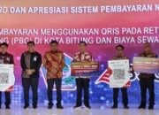 BSG Serahkan QRIS Retribusi Rusunawa dan PBG pada North Sulawesi Investment Forum 2024